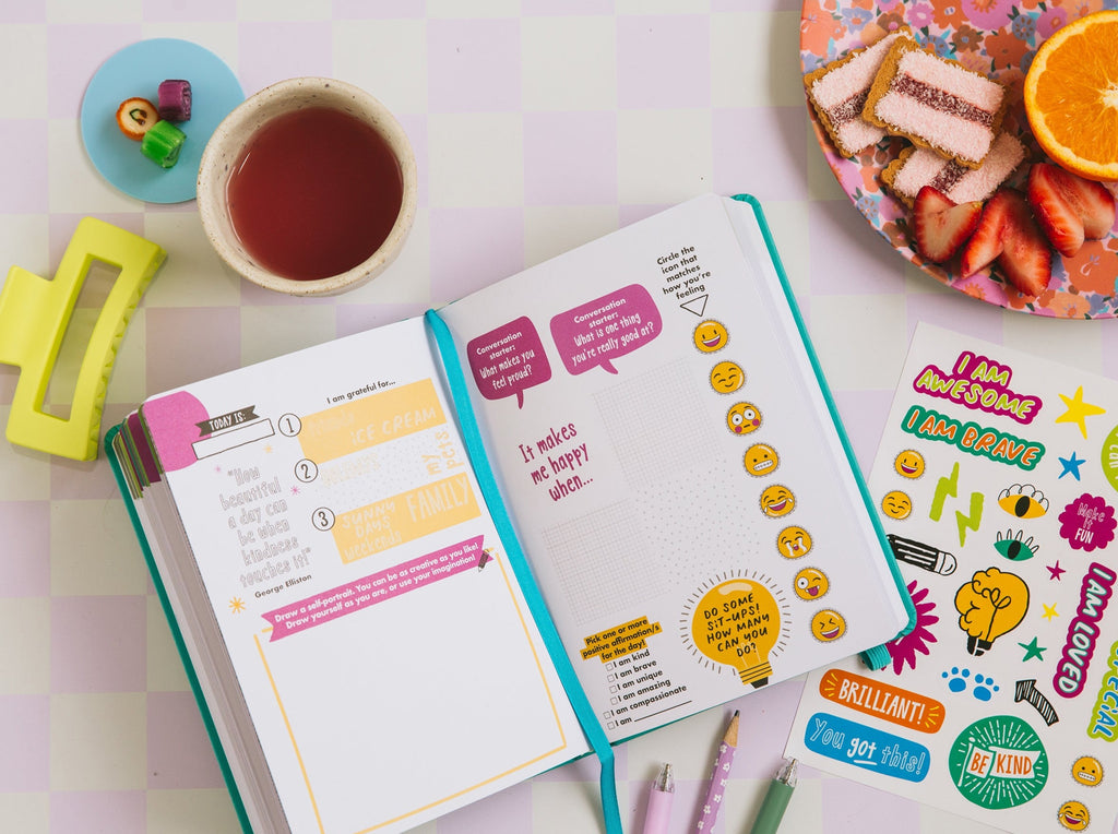 The kids grow journal for young girls in turquoise styled with fun stationery and snacks