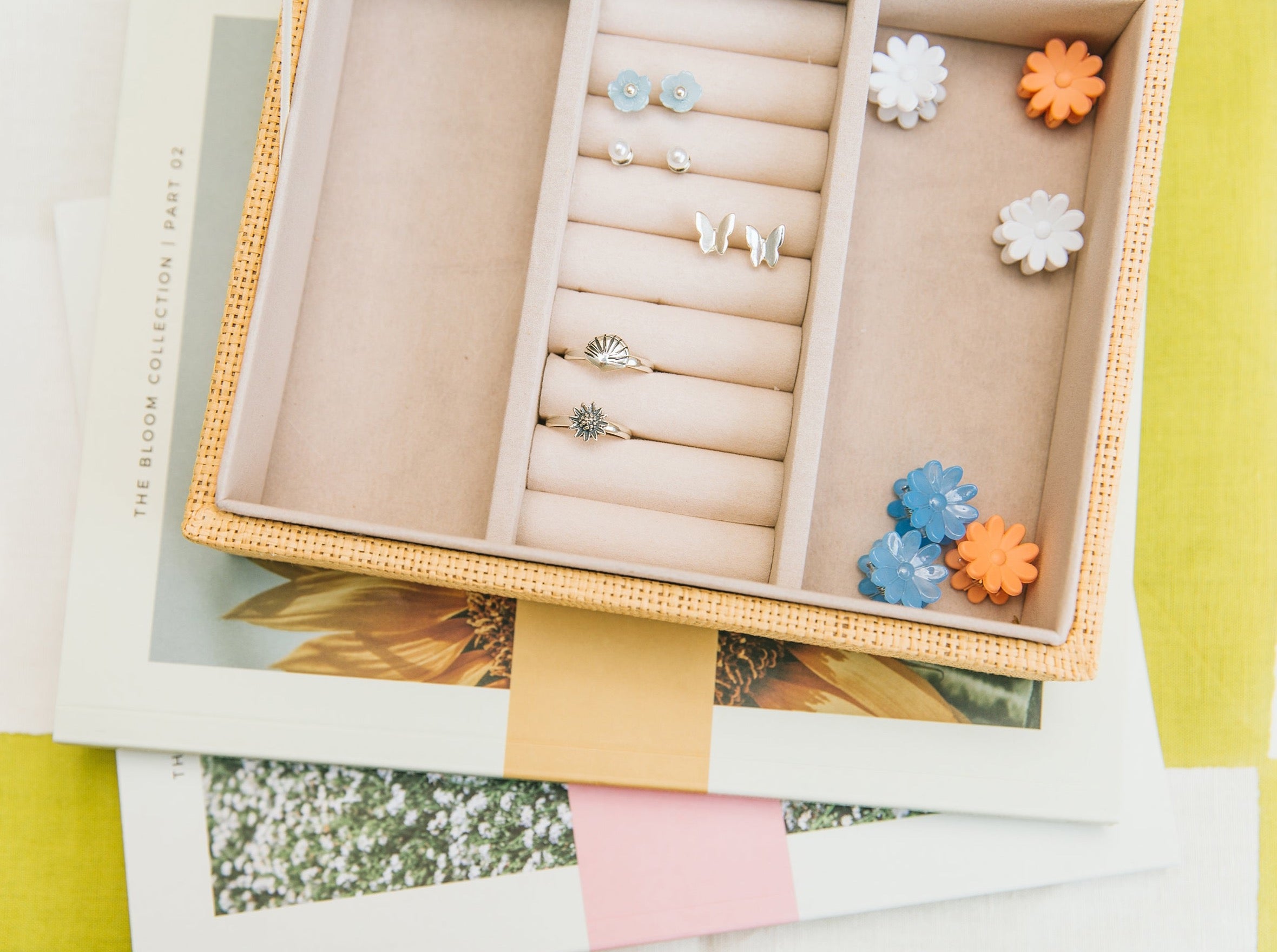 Pippin Girl rings in a jewellery box sitting on top of Bloom books